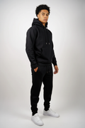Three-quarter view of black fleece sweatsuit set