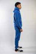 Side view of royal blue fleece sweatsuit set