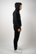 Side view of black fleece sweatsuit set