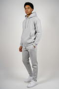 Three-quarter view of gray fleece sweatsuit set